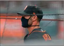  ?? Bay Area News Group/tns ?? San Francisco Giants manager Gabe Kapler watches the game from the dugout against the Oakland Athletics in the first inning of their exhibition game at Oracle Park in San Francisco on Tuesday.