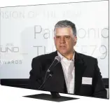  ??  ?? LEFT: Panasonic Australia’s Mark Hubbard collects the award for the FZ950 OLED.