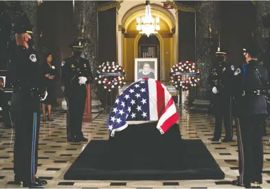  ?? ERIN SCHAFF-POOL/GETTY IMAGES ?? The casket of Justice Ruth Bader Ginsburg lies in state at the U.S. Capitol during a memorial service on Friday.