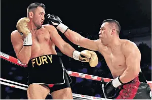  ??  ?? On the attack: Joseph Parker keeps opponent Hughie Fury on the ropes during his successful title defence last year