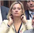  ??  ?? Amber Rudd cut an isolated figure as she shunned her usual spot on the front bench