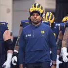  ?? MARK J. REBILAS/USA TODAY SPORTS ?? While holding the offensive coordinato­r title, Sherrone Moore has been a vital piece behind Michigan’s threeyear run.