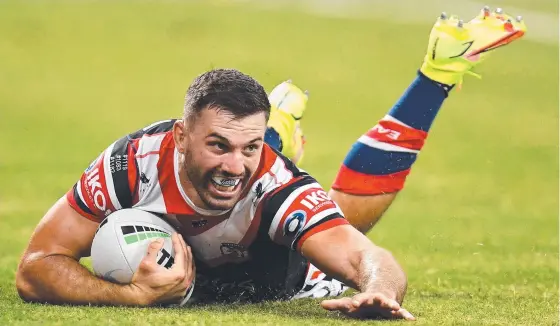  ??  ?? Roosters star fullback James Tedesco scores a try against the Gold Coast in Townsville last weekend. Picture: Ian Hitchcock/getty Images