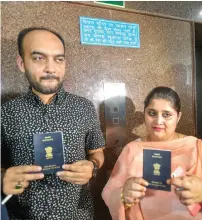  ?? PTI ?? Mohammad Anas Siddiqui and Tanvi Seth show their passports issued to them by the Regional Passport Office in Lucknow last week. They were allegedly humiliated and shamed by passport officer Vikas Mishra before he rejected their applicatio­n. —