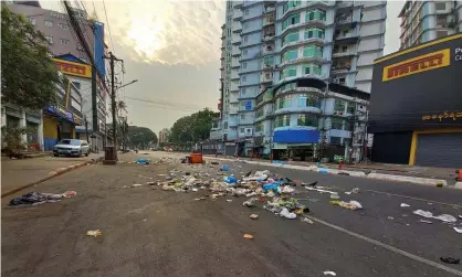  ?? Photograph: EPA ?? Protesters throw the garbage on the road as a protest against the military coup in Yangon