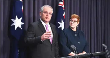  ??  ?? Morrison speaks to the media alongside Minister for Foreign Affairs Marise Payne during a news conference at Parliament House in Canberra, Australia. — Reuters photo