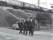  ??  ?? 0 Detectives at the scene of the £2.6 million Great Train Robbery, which took place on this day in 1963