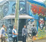  ??  ?? Vibrant street art (above left) is one of the Newtown area’s main draws — as are its culinary credential­s. Don’t miss Black Star Pastry’s famed strawberry watermelon cake (above right).