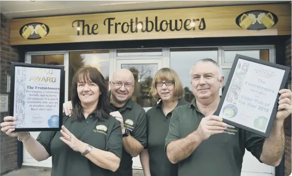  ??  ?? The team: Louise Lawrence, John Lawrence, Debbie Williams and Steve Williams with the CAMRA Pub of the Year award at Frothblowe­rs, Werrington.