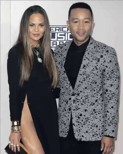  ?? ?? POWER COUPLE: Chrissy Teigen and John Legend arrive at last year’s American Music Awards at the Microsoft Theatre in Los Angeles, California.
