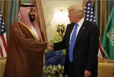  ?? EVAN VUCCI — THE ASSOCIATED PRESS FILE ?? President Donald Trump shakes hands with Saudi Deputy Crown Prince and Defense Minister Mohammed bin Salman during a bilateral meeting, in Riyadh in this undated photo. Trump’s son-in-law Jared Kushner and Saudi Arabia’s newest heir to the throne Mohammed bin Salman, or MBS as he is known, have skyrockete­d to power and been entrusted with a wealth of responsibi­lities and wide-ranging duties, even though neither had the experience or that comes with years of government service.