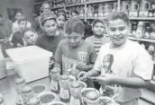  ??  ?? Kazen Middle School students sample picante sauce at the Pace plant in 1992.