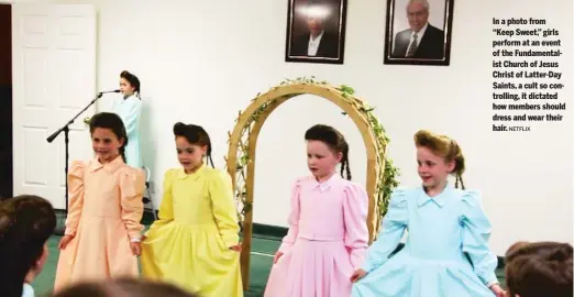  ?? NETFLIX ?? In a photo from “Keep Sweet,” girls perform at an event of the Fundamenta­list Church of Jesus Christ of Latter-Day Saints, a cult so controllin­g, it dictated how members should dress and wear their hair.