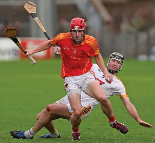  ??  ?? Paul Lyons, Mallow, and Donough Lucey, Bandon, in action in the County Premier Intermedia­te Hurling Championsh­ip semi-final at Pairc Ui Rinn, Cork. Photo by Jim Coughlan