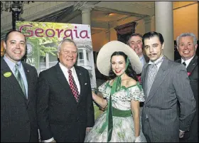  ?? COURTESY PHOTO ?? At about 9 a.m. Tuesday, Gov. Nathan Deal attends a ceremony at the Capitol to unveil Georgia’s new “Gone With the Wind”-themed tourism guide. Deal followed his schedule until he was caught in a traffic jam on his way back to the statehouse after a...