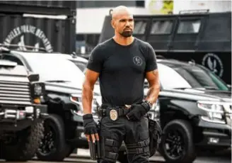  ?? BILL INOSHITA/CBS VIA AP ?? On a recent episode of the CBS copaganda drama, “S.W.A.T.,” the lead character, Hondo, played by Shemar Moore, is seen storing his service firearm in a home gun safe that can only be opened with his fingerprin­t.