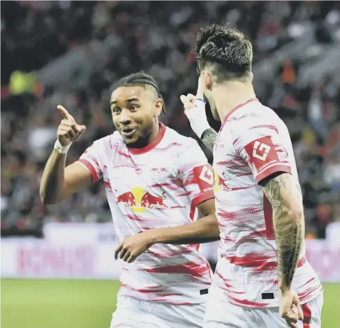  ?? ?? French forward Christophe­r Nkunku, left, is one of RB Leipzig's form players and is already on the 30-goal mark this season