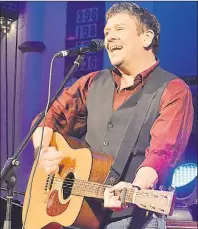  ?? SALLY COLE/THE GUARDIAN ?? Singer-songwriter Lennie Gallant performs “Peter’s Dream” on the Folk Stage at the 2017 East Coast Music Awards in Saint John on Saturday. He was awarded folk recording of the year at the showcase at St. Andrew and St. David United Church.