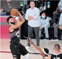  ?? MARK J. TERRILL THE ASSOCIATED PRESS ?? Denver Nuggets guard Jamal Murray goes up for a shot against the Los Angeles Lakers’ late in Game 3 of the Western Conference final. Murray scored 28 points in a Denver victory.