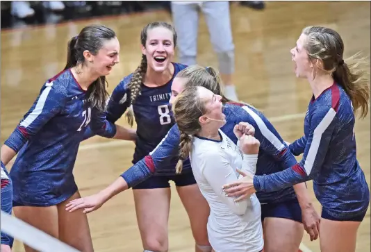  ?? Dan Watson/The Signal (See additional photos on signalscv.com) ?? Trinity Classical Academy teammates from left, Jessica Eblin (24), Kathryn Brooks (8), Allie Brown (18) Mary MacAdam (7) and Hannah Caddow (13) celebrate their win of the second game against SCCS at SCCS last season. The Knights won their first-ever...