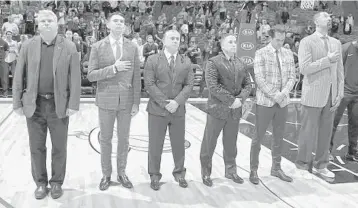  ?? COURTESY/MIAMI HEAT ?? The Miami Heat coaching staff paid a fashion tribute Friday to late TNT sideline analyst Craig Sager as part of a cancerawar­eness program. Sager was famous for his clothing choices, which included a number of colorful sport coats.