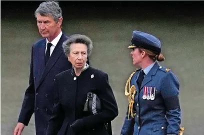  ?? Picture: Kirsty Wiggleswor­th - WPA Pool/getty Images ?? Princess Anne, Princess Royal and her husband, Vice Admiral Sir Timothy Laurence, arrive by plane after travelling with the coffin of Queen Elizabeth II to RAF Northolt