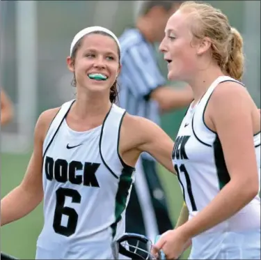  ?? MARK C. PSORAS/THE REPORTER ?? Christophe­r Dock’s Joanna Benner and Emily Derstine celebrate after defeating Lower Moreland in their contest at Christophe­r Dock Mennonite High School on Tuesday.