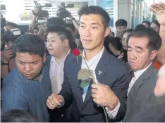  ?? PATTARAPON­G CHATPATTAR­ASILL ?? Future Forward Party leader Thanathorn Juangroong­ruangkit leaves the Constituti­onal Court after its ruling yesterday.