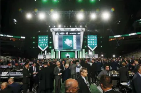  ?? MICHAEL AINSWORTH — THE ASSOCIATED PRESS ?? League and team officials attend the NHL hockey draft in Dallas, Friday.