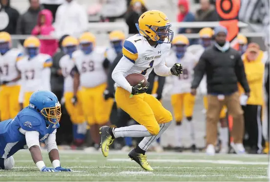  ?? ALLEN CUNNINGHAM/SUN-TIMES ?? Crete-Monee’s Joshua Franklin runs past a Simeon defender during a Class 6A playoff game Saturday at Gately Stadium.