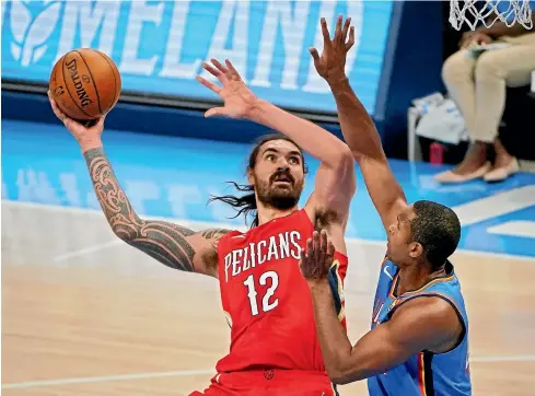  ?? AP ?? Steven Adams shoots a basket in front of Oklahoma City Thunder centre Al Horford during the New Orleans Pelicans’ win in an NBA match yesterday.
