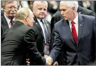  ?? AP/YONG TECK LIM ?? Russian President Vladimir Putin and Vice President Mike Pence share a moment Thursday at the Associatio­n of Southeast Asian Nations summit in Singapore. At left is White House national security adviser John Bolton.