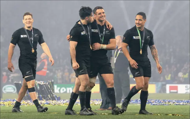  ?? Picture: BACKPAGEPI­X ?? FREEDOM, FEARLESSNE­SS AND FUN: New Zealand’s Tawera Kerr-Barlow, Nehe Milner-Skudder, Dan Carter and Aaron Smith celebrate winning the World Cup at Twickenham.