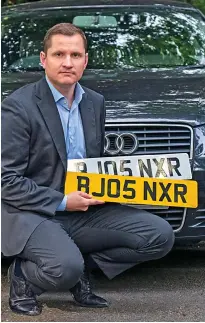  ?? ?? Too easy: Our reporter with number plates that he bought online and were shipped from Jersey