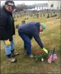  ?? ERIC DEVLIN - FOR MEDIANEWS GROUP ?? John Kane and his son Jack, of Salford Township, lay a wreath at the headstone of a veteran buried in Wentz’’s United Church of Christ cemetery during a ceremony Saturday.