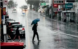  ?? ?? The record rainfall that hit Auckland last week caused a downturn in consumer spending.