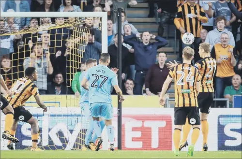  ?? PICTURE:DANNY LAWSON/PA WIRE ?? ON TARGET: Michael Dawson nods home an equaliser for Hull City but they went on to suffer a 3-2 home defeat against Wolverhamp­ton Wanderers last night.