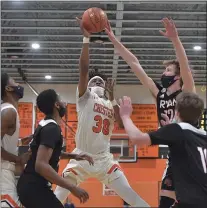  ?? PETE BANNAN - MEDIANEWS GROUP ?? Chester’s Karell Watkins, center, has his shot blocked by Archbishop Ryan’s Christian Tomasco, left, among the myriad company in the lane. Watkins and Chester never got going in an 84-63setback in the PIAA Class 5A semifinal.