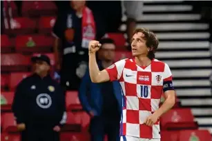  ?? (POOL/AFP via Getty I mages) ?? Luka Modric celebrates scoring Croatia’s second