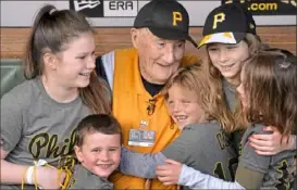  ?? Matt Freed/Post-Gazette ?? Phil Coyne surrounds himself with grandniece­s and grandnephe­ws for his 100th birthday celebratio­n on April 27, 2018, at PNC Park.