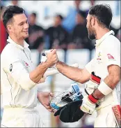  ??  ?? Australian cricketers Peter Handscomb (L) and Glenn Maxwell (R) celebrate after winning second Test against Bangladesh at Zahur Ahmed Chowdhury Stadium in Chittagong on Thursday