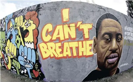  ?? | AP ?? GRAFFITI by artist ‘EME Freethinke­r’ that expresses support of US protests over the death of George Floyd, a black man who died in police custody, and others are pictured in Mauerpark in Berlin, Germany.