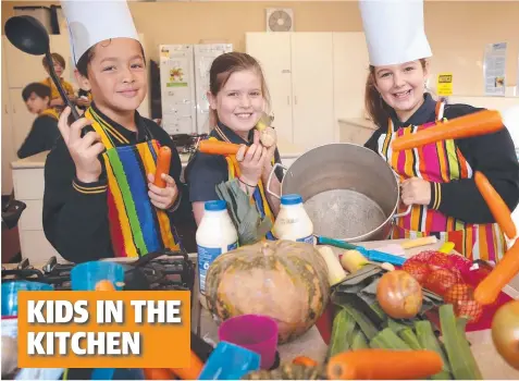  ?? Picture: ALISON WYND ?? WINTER WARMER: Ashby Primary students Marcel Faull, Scarlett White and Tameka Josifovska in the soup kitchen.