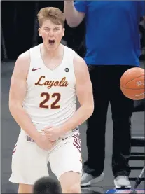  ?? JEFF ROBERSON/AP ?? Loyola of Chicago's Jacob Hutson (22) celebrates after making a basket during the Missouri Valley Conference tournament final on Sunday.