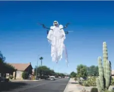  ??  ?? Drone owners inspired by Halloween have been adding ghostly gauze on top of the flying devices. This is a drone from DJ Vegh, from Arizona. Photo provided by DJ Vegh