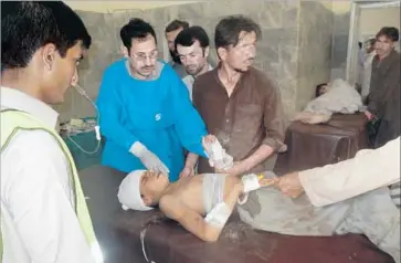  ?? Anwarullah Khan Associated Press ?? A CHILD injured in a suicide bombing in Pai Khan is treated at a hospital in Khar, about two hours away. No group immediatel­y claimed responsibi­lity for the attack, which occurred during Friday prayers.