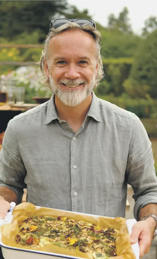  ?? ?? TV TO TUCK INTO: Marcus Wareing, left, putting his smallholdi­ng to good use and, inset opposite, getting to know his rare breed Mangalitza pigs from Thirsk.