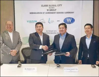 ??  ?? Global Gateway Developmen­t Corp. and W Group signed a memorandum of agreement last Feb. 28 to sublease 21,918 square meters in Clark Global City. In the photo are (from left) GGDC vice chairman and president Wilfredo Placino; GGDC chairman Dennis Uy; W Group, Inc. president Norman Vincent Wee; and W Group, Inc. chief executive officer Francis Augustus Wee.