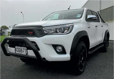  ??  ?? The much more substantia­l-looking Toyota Hilux TRD, featuring its more macho nose. Rear includes a black sports bar, and nicelookin­g decalling on the wellside.