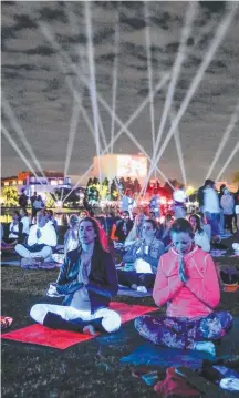  ?? Picture: ART-WORK AGENCY ?? Glow Yoga at Saturday night’s festival.